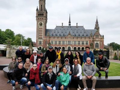 image of group tour in front of peace palace in the Hague